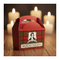 Red Burns Night party box on a wood table with the candlelit glow behind