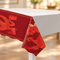 Red Chinese dragon table cover on a white table with a warm blurred background, square format