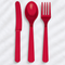 Red plastic cutlery set on a white tablecloth with light and shade, square format