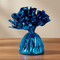 Royal blue balloon weight on a wood table with a neutral background
