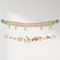 Safari birthday banner against a white wall with soft light and shade, in square format
