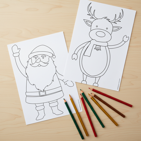 Santa and Rudolph Colouring Sheets Flat Lay with Pencils