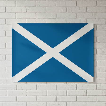 Scotland flag poster on a white brick wall