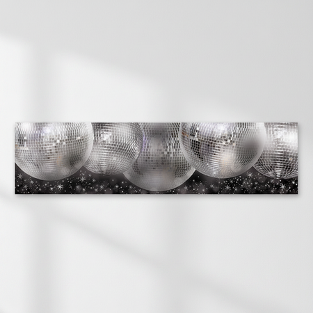 Silver disco-ball banner on a white wall