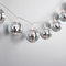 Silver Disco Ball Lights Extreme Close Up Plain Silver Background