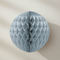 Silver paper decoration against a neutral wall
