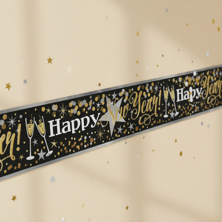 Single Happy New Year banner angled across a cream wall