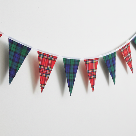 Single strand of mixed tartan bunting, nothing else in frame