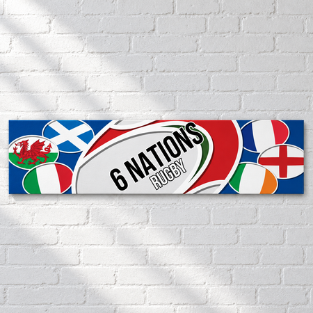 Six Nations rugby banner close-up on a white brick wall with soft light and shade, in square format