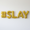 #SLAY Gold Balloons Against Wall
