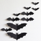 Square bat wall display sweeping diagonally from large bats on the left to small bats on the right