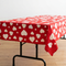 Square close-up of the heart-covered table with a clear tabletop and no flowers or decorations