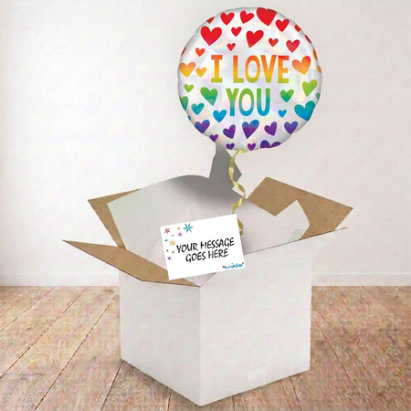 Square rainbow I LOVE YOU balloon gift using the previous image’s wooden floor and white wall background reference