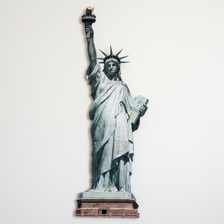 Statue of Liberty Cardboard Cutout Against Plain White Wall