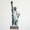 Statue of Liberty Cardboard Cutout Against Plain White Wall