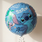 Stitch balloon floating with silver curling ribbon against a neutral wall with soft light and shade, close up in square format