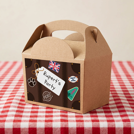 Suitcase-style party box close up on a red-and-white checked tablecloth with a neutral background, in square format