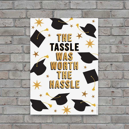 Tassle Hassle Poster on Grey Brick Wall