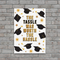 Tassle Hassle Poster on Grey Brick Wall