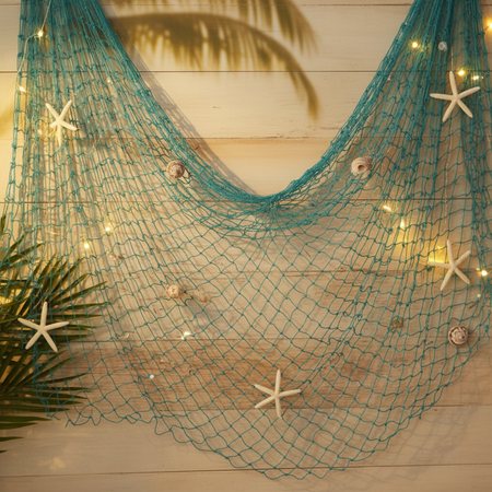 Teal Decorative Fishing Net as Party Prop on Wall