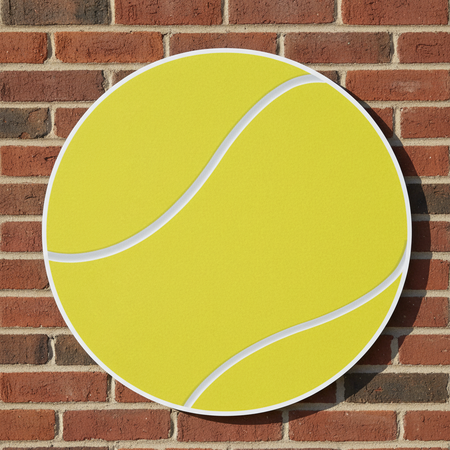 Tennis Ball Cutout on Red Brick Wall