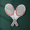 Tennis Racket Cutouts Against Green Wall