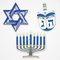 Three Hanukkah cardboard cut-outs on a white wall
