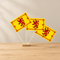 Three rampant lion table flags on a wood table
