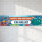 Underwater birthday banner on a white brick wall with soft light and shade, in square format