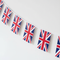 Union Jack Paper Bunting Diagonal Angle Against White Wall
