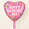Valentine’s sprinkles balloon floating with bright pink curling ribbon against a cream background with soft light and shade, in square format
