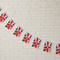 VJ Day Bunting on White Brick Wall at Angle