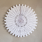 White Paper Fan on Warm Taupe Background