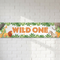Wild One banner on a white brick wall with soft light and shade, in square format