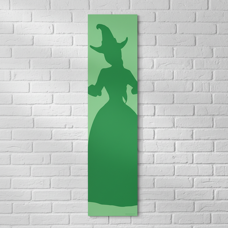 Witches of Oz Green Banner on White Brick Wall