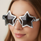 Woman Wearing Silver Star Glasses Close Up on Neutral Background