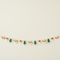 Woodland deer, tree and toadstool garland strung across a cream wall