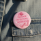 Pink button with 'Yeehaw I'm Getting Married' text on a denim jacket.