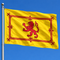 Yellow flag with a red lion flying against blue sky